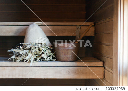 bath hat and Russian bath or sauna room with accessories, traditional steam bath with broom hot steam bath hat and Russian bath or sauna room with accessories, traditional steam bath with broom hot steam 103324089