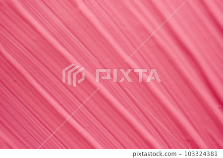 Texture background of smears of pink matte liquid lipstick or eye shadow 103324381