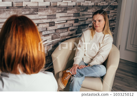 Psychologist having session with patient. Psychotherapy consultation. Psychologist having session with patient. Psychotherapy consultation. 103325012