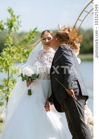 wedding ceremony of the newlyweds on the pier 103325349