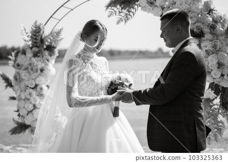 wedding ceremony of the newlyweds on the pier 103325363