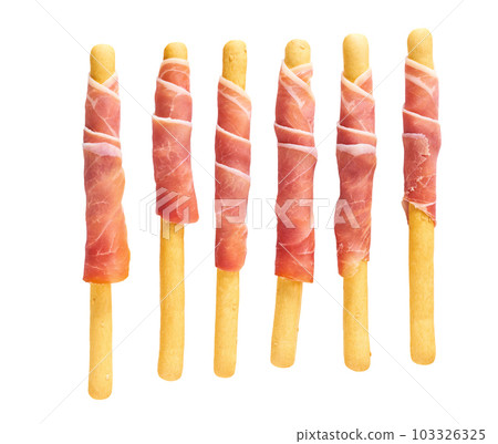 italian stick bread grissini with parma ham prosciutto, traditional breadsticks with prosciutto isolated on white background top view. italian stick bread grissini with parma ham prosciutto, traditional breadsticks with prosciutto isolated on white background top view. 103326325
