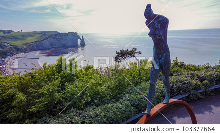 Aerial view on statue of Armenian author in Etretat Gardens in Tretat and bay of town Falaise d'Aval Aerial view on statue of Armenian author in Etretat Gardens in Tretat and bay of town Falaise d'Aval 103327664