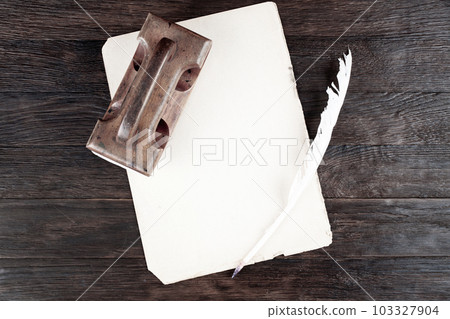 Vintage fountain pen and empty sheet of paper on wooden table 103327904