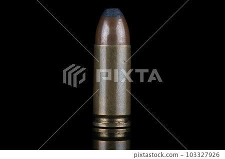 9mm caliber round with reflexion on black with reflexion. 9mm caliber round with reflexion on black with reflexion. 103327926