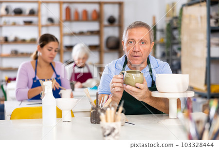 potter with his jug 103328444
