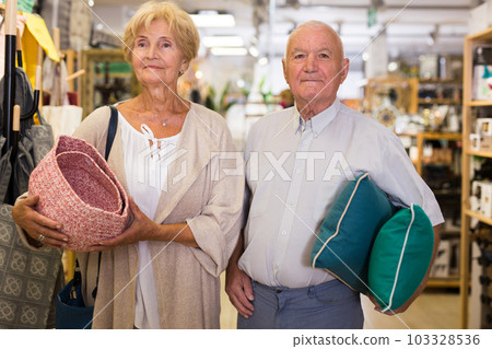 Mature family couple shopping at household store 103328536