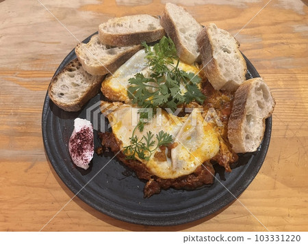 Shakshuka (a popular breakfast dish in Middle Eastern countries such as Israel) 103331220