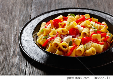 pepper tomato mozzarella pasta salad in bowl pepper tomato mozzarella pasta salad in bowl 103335215