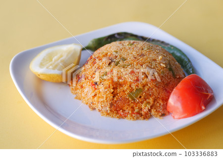 bulgur rice with tomato on a plate , bulgur rice with tomato on a plate , 103336883