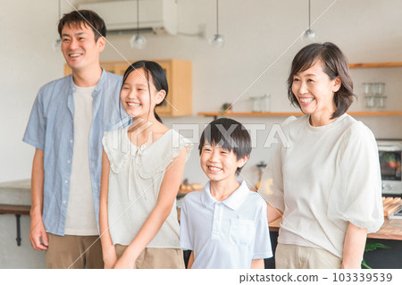 A friendly family with a smile, a family of four A friendly family with a smile, a family of four 103339539