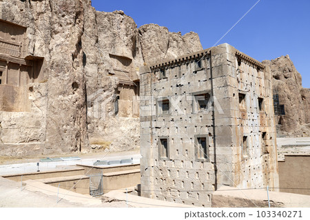 Royal tombs and Cube of Zoroaster (Ka'ba-ye Zartosht ) in ancient necropolis Naqsh-e Rustam, Achaemenid dynasty, Fars province, Iran. UNESCO world heritage site Royal tombs and Cube of Zoroaster (Ka'ba-ye Zartosht ) in ancient necropolis Naqsh-e Rustam, Achaemenid dynasty, Fars province, Iran. UNESCO world heritage site 103340271