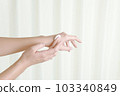 A woman doing hand care 103340849