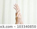 A woman doing hand care 103340850