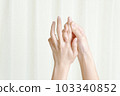 A woman doing hand care 103340852