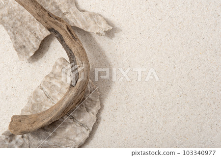 Natural cosmetic background for product presentation. Rocks and driftwood on the sand. Top view. 103340977