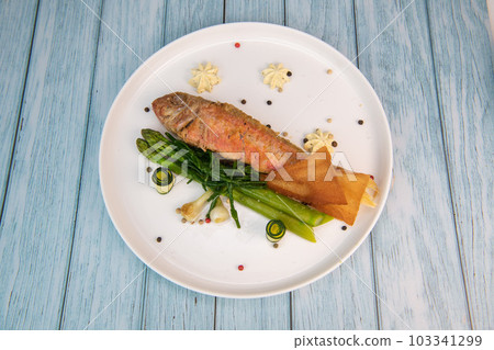 Plate of fried small fish red mullet with green asparagus Plate of fried small fish red mullet with green asparagus 103341299
