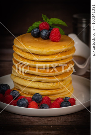 Recipe for maple syrup pancakes with raspberry and blueberry filling Recipe for maple syrup pancakes with raspberry and blueberry filling 103341351