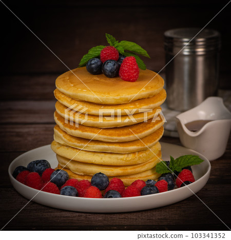 Recipe for maple syrup pancakes with raspberry and blueberry filling Recipe for maple syrup pancakes with raspberry and blueberry filling 103341352