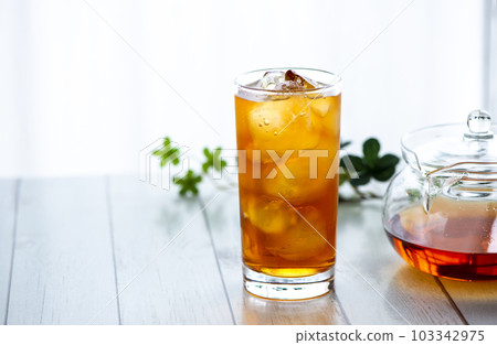 Cold iced tea by the window 103342975