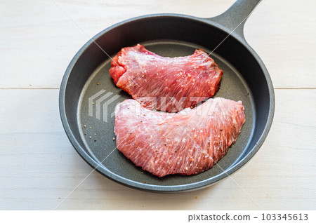 tuna cheeks cooked in a skillet tuna cheeks cooked in a skillet 103345613