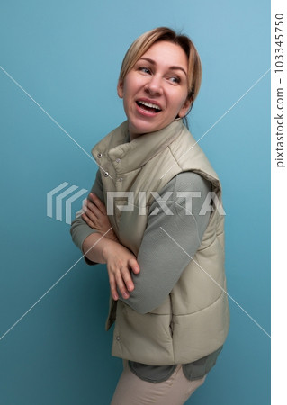 portrait of a pretty european 30 year old woman in comfortable clothes smiling friendly 103345750