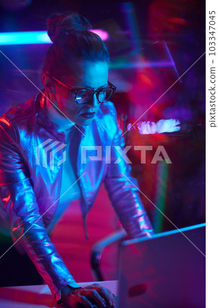 trendy woman in glasses with laptop in modern office trendy woman in glasses with laptop in modern office 103347045
