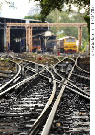 Numerous railroad tracks lead to a train garage Numerous railroad tracks lead to a train garage 103347055