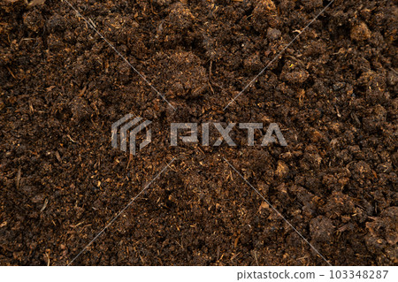 Horse Manure Compost for cultivation, agriculture. Natural Eco Bio Fertilizer. Closeup texture brown wallpaper. Composted steer manure background. Organic fertiliser. Animal Dung. Droppings plant food 103348287