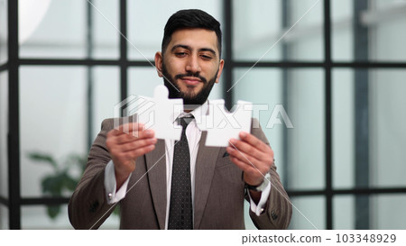 businessman show white jigsaw in hand, business strategy concept businessman show white jigsaw in hand, business strategy concept 103348929