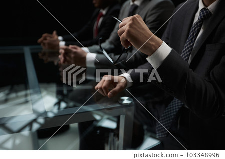 Close up of male hands holding a pair of glasses Close up of male hands holding a pair of glasses 103348996