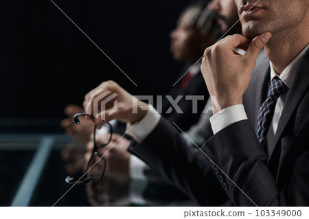 Close up of male hands holding a pair of glasses Close up of male hands holding a pair of glasses 103349000