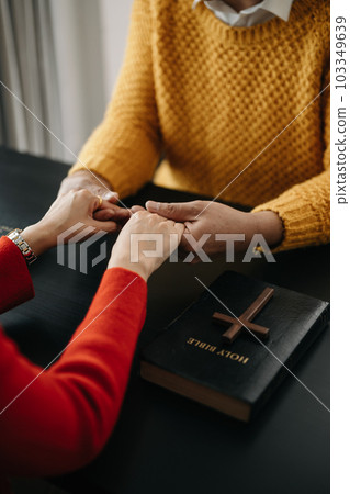 Woman's hand with cross .Concept of hope, faith, christianity, religion, church and pray to God. on the black table.. Woman's hand with cross .Concept of hope, faith, christianity, religion, church and pray to God. on the black table.. 103349639