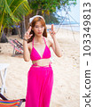 young girl sitting on the beach. by sea. tropical beach. summer style. 103349813