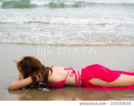young girl sitting on the beach. by sea. tropical beach. summer style. young girl sitting on the beach. by sea. tropical beach. summer style. 103350038