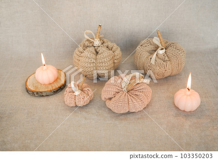 Hobby background with handmade knit pumpkins and white pearl beads. DIY, craft decoration for fall and winter holidays. Hobby background with handmade knit pumpkins and white pearl beads. DIY, craft decoration for fall and winter holidays. 103350203