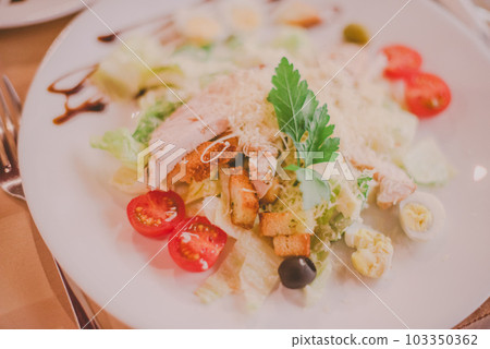 The Caesar salad prepared on the classical recipe. The Caesar salad prepared on the classical recipe. 103350362