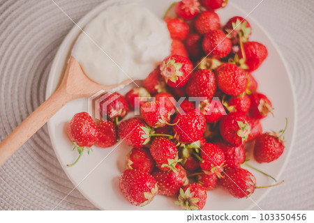 Bunch of bananas and strawberries. Photo toned style Instagram filters. Concept of healthy breakfast. Flatlay 103350456