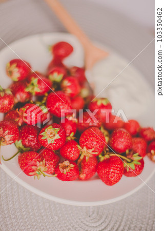 Bunch of bananas and strawberries. Photo toned style Instagram filters. Concept of healthy breakfast. Flatlay Bunch of bananas and strawberries. Photo toned style Instagram filters. Concept of healthy breakfast. Flatlay 103350462