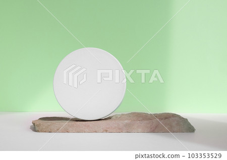 Podium for cosmetic product presentation. Abstract minimal geometrical form with natural Stone. Cylinder podium sphere, geometric circle shape, soft shadow. Scene, showcase, display. Front view 103353529