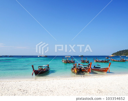 Thai remote island beach moored boat Thai remote island beach moored boat 103354652