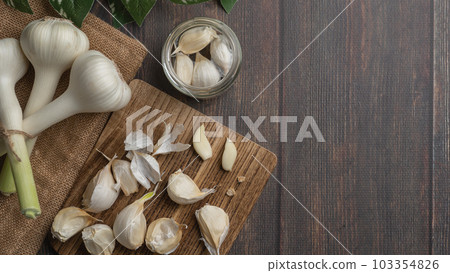 Image of peeling garlic Image of peeling garlic 103354826