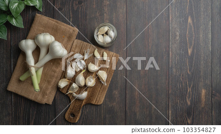 Image of peeling garlic Image of peeling garlic 103354827