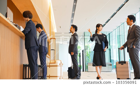 Travelers receiving guidance at the front desk 103356091