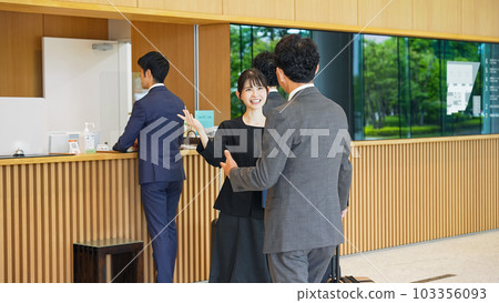 Travelers receiving guidance at the front desk Travelers receiving guidance at the front desk 103356093