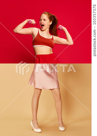 Collage with combination portraits of young beautiful girl with redhead wearing sportswear and elegant cocktail dress over red and blue background 103357378