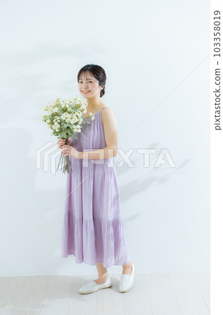 Woman with a bouquet 103358019