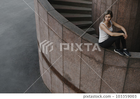 Portrait of young sporty parkour woman. Freeruning female Portrait of young sporty parkour woman. Freeruning female 103359003