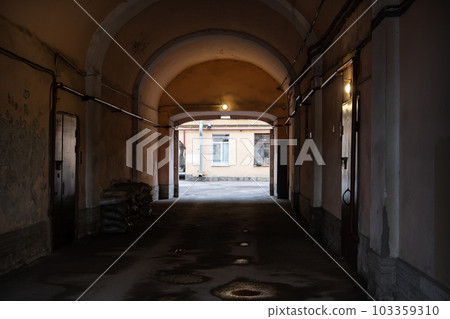 Old dark gateway with glowing exit. Abstract architecture photo Old dark gateway with glowing exit. Abstract architecture photo 103359310