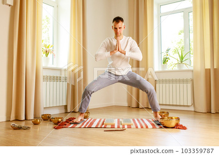 morning yoga practice with sadhu nails. mans foot on the wooden desk with sharp metal nails morning yoga practice with sadhu nails. mans foot on the wooden desk with sharp metal nails 103359787